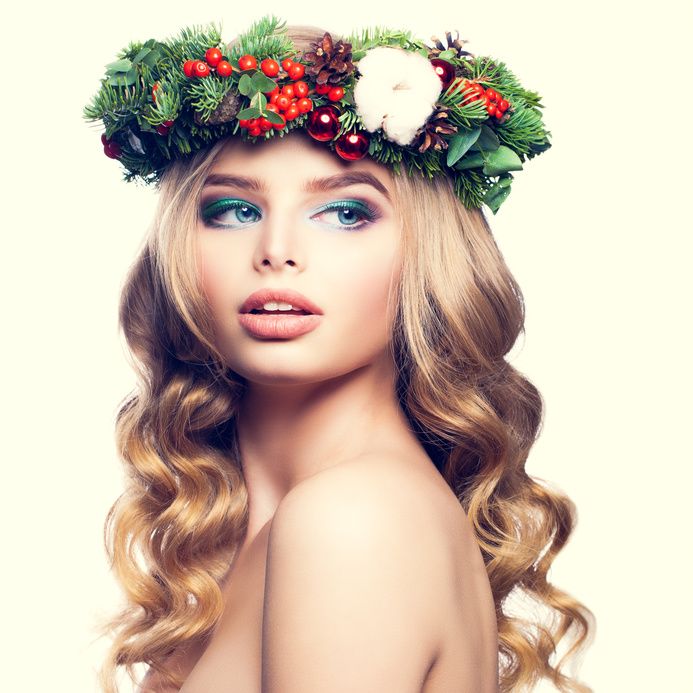 Christmas or New Year Model Woman. Cute Face, Blonde Hairsyle and Makeup